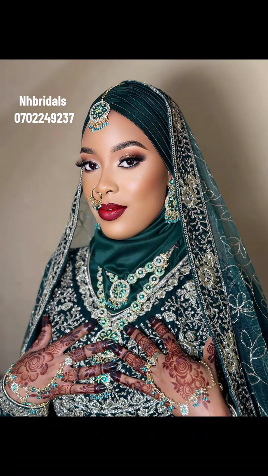 Bridal beauty look with an emerald head adornment and detailed henna